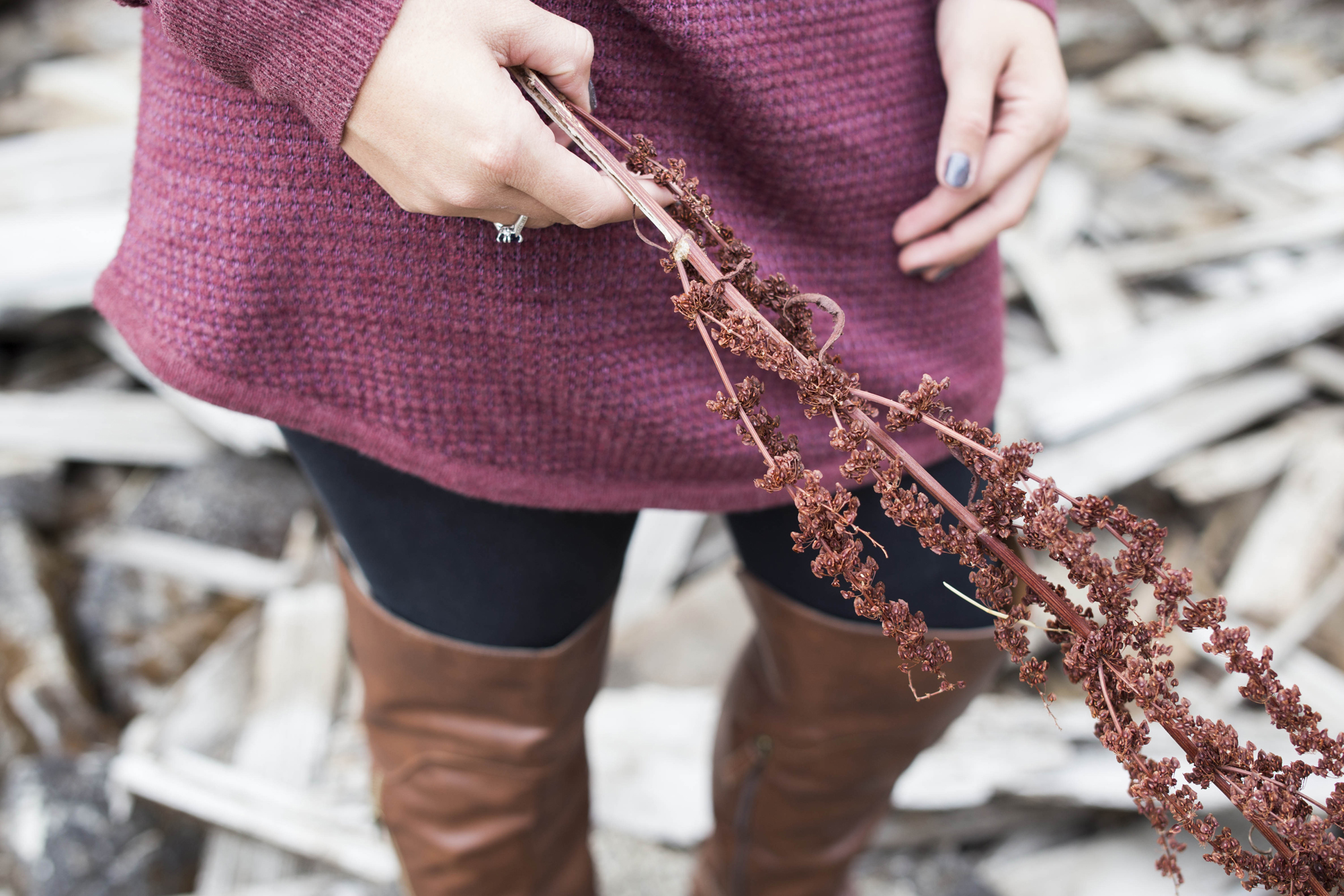 Senior model holds a branch with blossoms