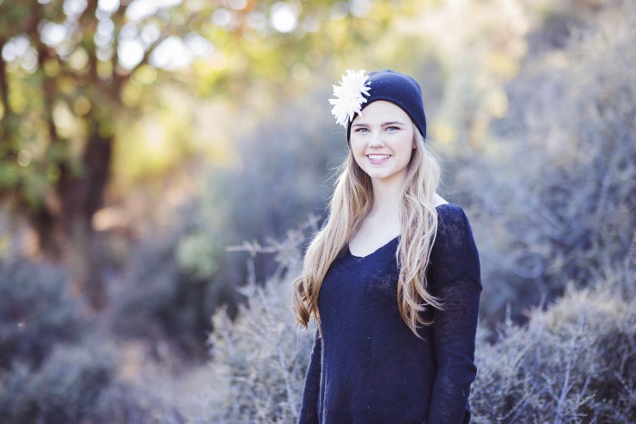 Senior with Black Beanie and Flower